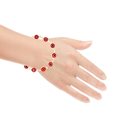 A hand wearing the Big Red Evil Eye Lucky Charm Bracelet 14k gold filled, featuring eye-shaped beads in red and black that provide spiritual protection.